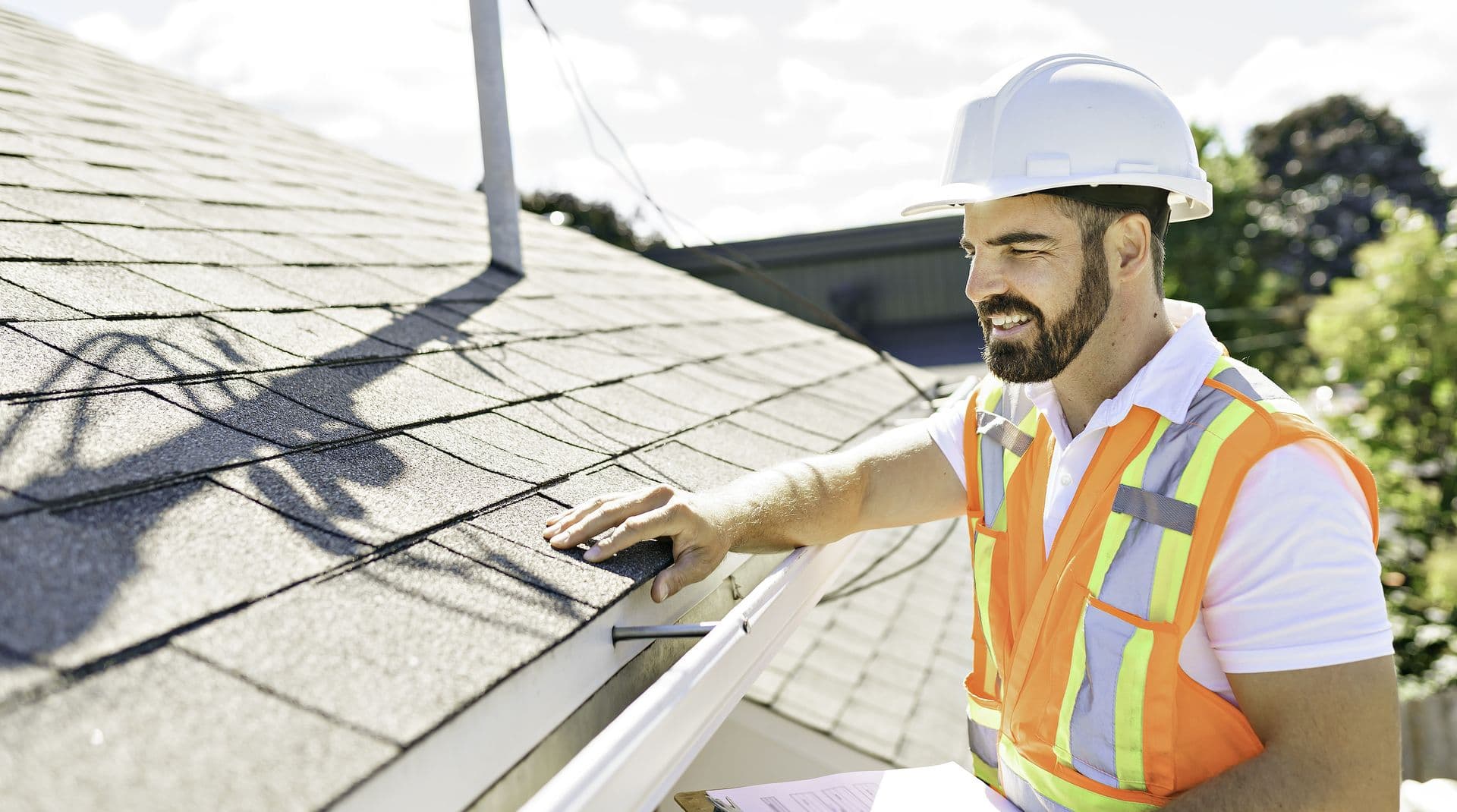 bigstock-Man-In-A-Hard-Hat-Holding-A-C-452437923 (1).jpg